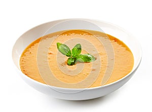 Bowl of squash soup with basil