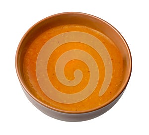 Bowl of squash soup isolated on a white