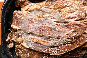 Bowl of raw beef rib steaks