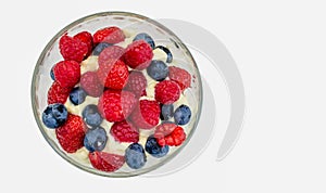 Bowl of strawberries, rasberries and blueberries isolated