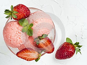 Bowl of strawberry ice cream close up