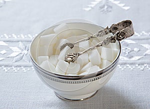 A bowl of sugar cubes.