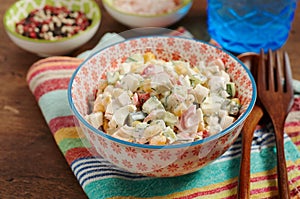 Bowl of Surimi Seafood Salad with sweet corn, cucumbers, boiled eggs and mayonnaise