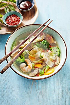 Bowl of tasty Chinese wonton soup with dumplings