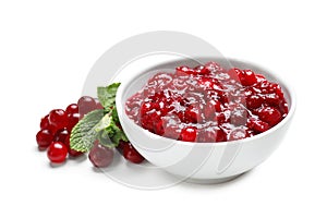 Bowl with tasty cranberry sauce on white background