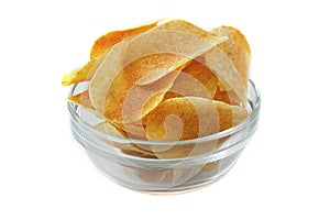 Bowl of tasty crispy potato chips on white background. Fast food snack