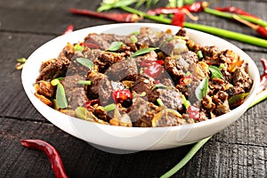 Bowl of tasty mutton  fry. Kerala foods background.