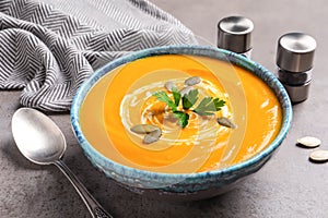 Bowl with tasty pumpkin soup served