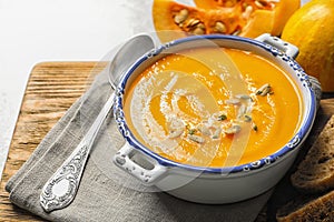 Bowl with tasty pumpkin soup served