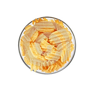 Bowl of tasty ridged potato chips on white background, top view