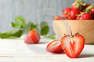 Bowl with tasty strawberry on wooden table Summer berry