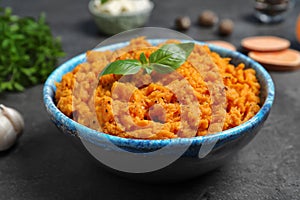 Bowl of tasty sweet potato puree on table