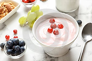 Bowl with tasty yogurt and berries