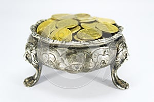 Bowl on three lions feet with coins