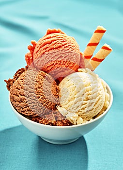 Bowl of three scoops of gelato with wafer straws