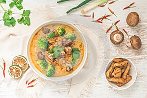 Bowl with Tom Kha Gai soup with various vegetables