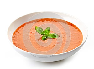 Bowl of tomato soup with basil