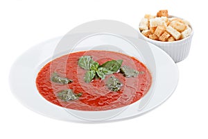 Bowl of tomato soup with croutons