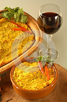 Bowl of traditional Chilean Pastel de Choclo (corn pie) the corn-basil