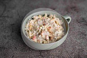 Bowl of traditional Russian salad called Olivie, Russian New Year or Christmas salad