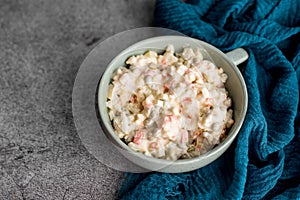 Bowl of traditional Russian salad called Olivie, Russian New Year or Christmas salad