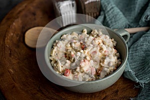 Bowl of traditional Russian salad called Olivie, Russian New Year or Christmas salad