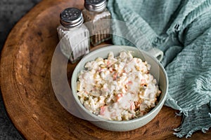Bowl of traditional Russian salad called Olivie, Russian New Year or Christmas salad