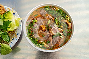 Bowl of traditional South Vietnamese noodle dish called Bun Bo Hue