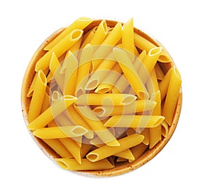 Bowl with uncooked penne pasta on white background