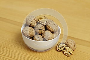 bowl of walnuts on wood