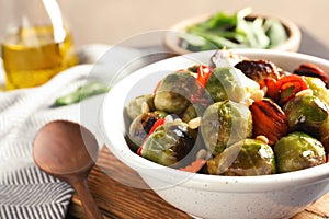 Bowl of warm salad with Brussels sprouts and carrots