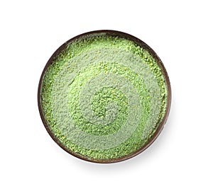 Bowl with wheat grass powder on white background