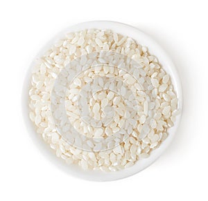 Bowl of white rice on white background, top view