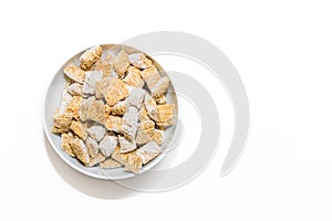 A bowl of whole grain cereal in a bowl on a white background