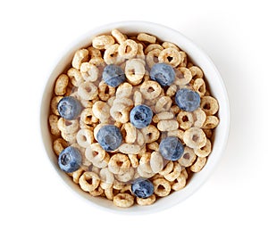 Bowl of whole grain cheerios cereal with blueberries isolated on