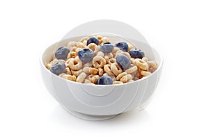 Bowl of whole grain cheerios cereal with blueberries isolated on