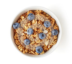 Bowl of whole grain muesli and blueberries isolated on white
