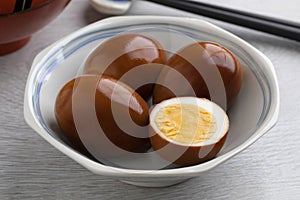 Bowl with whole and half soy sauce eggs, Shoyu tamago