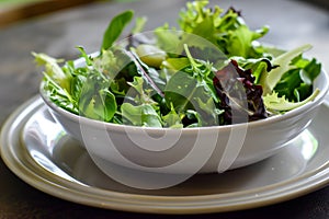bowl of wilting salad left untouched on a dinner plate