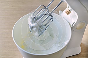 Bowl with wipped cream and mixer