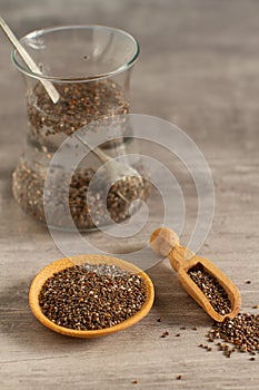 Bowl and wooden scoop with chia seeds