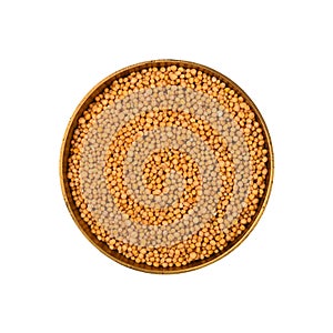 Bowl of yellow mustard seeds isolated