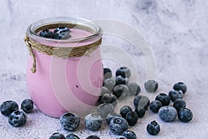 Bowl with yogurt and blueberries on table. Blueberry yogurt with fresh blueberries. Healthy breakfast. Super food