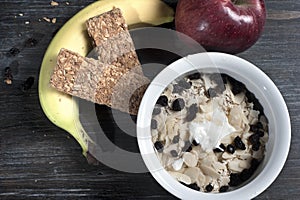 Bowl with yogurt and muesli on floor