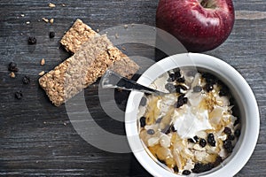 Bowl with yogurt, muesli and honey on floor