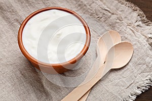 Bowl of yogurt served on table
