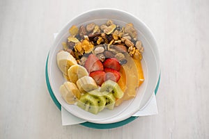 Bowl of yogurth. granola and fresh fruits photo