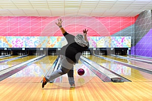 Bowler throw the ball at the bowling lane