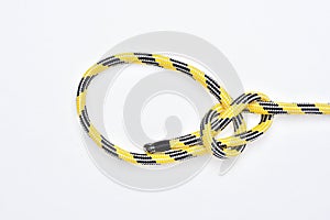 Bowline knot on yellow and black nylon rope