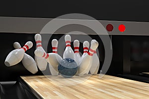 Bowling ball hitting all 10 pins, in a Strike